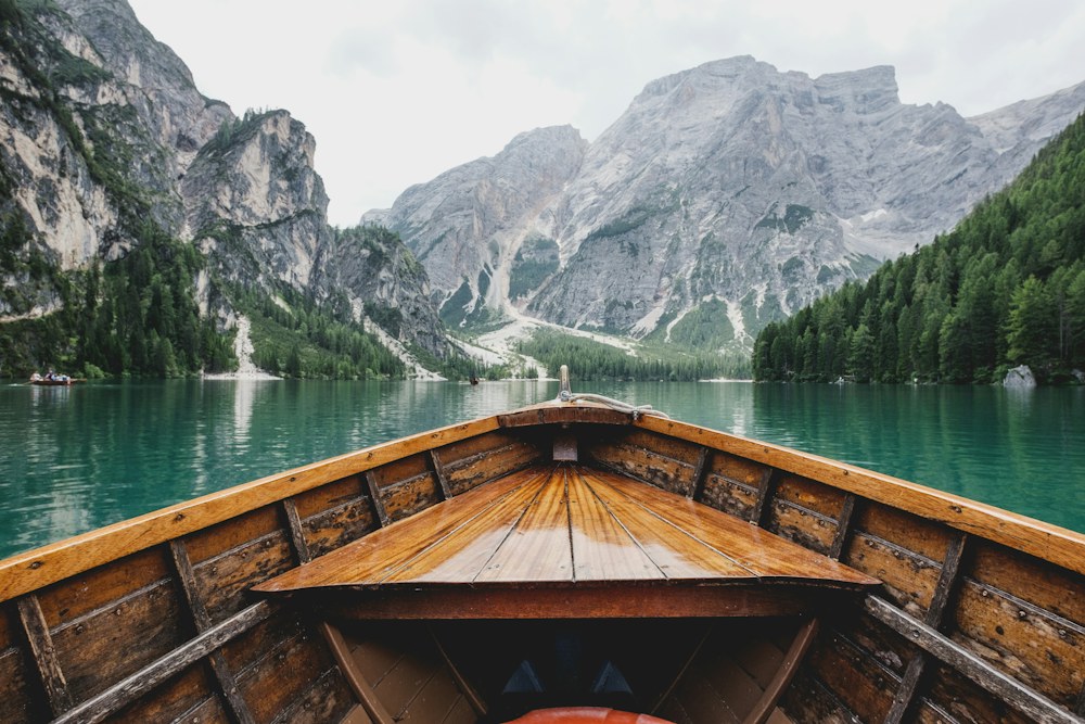 A calm lake and mountain landscape, inviting a considered travel plan